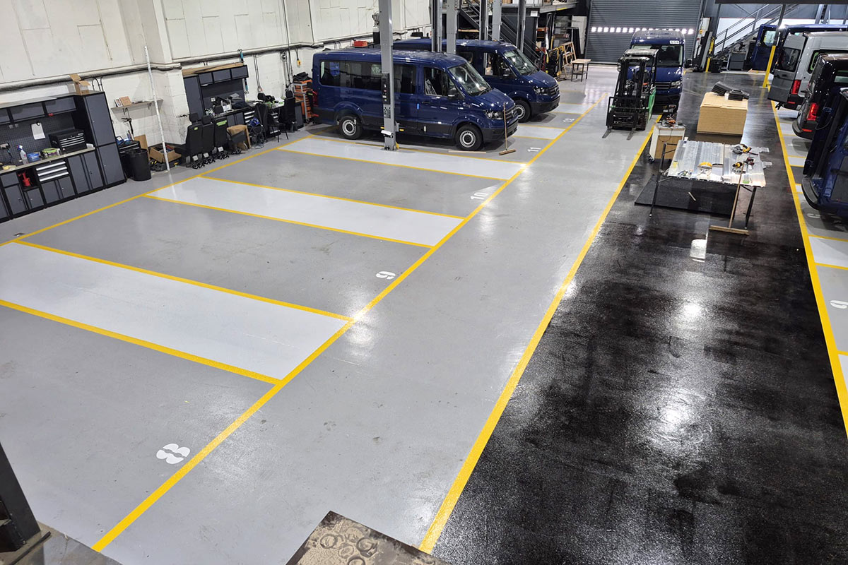 Line marking for vehicle bays in workshop